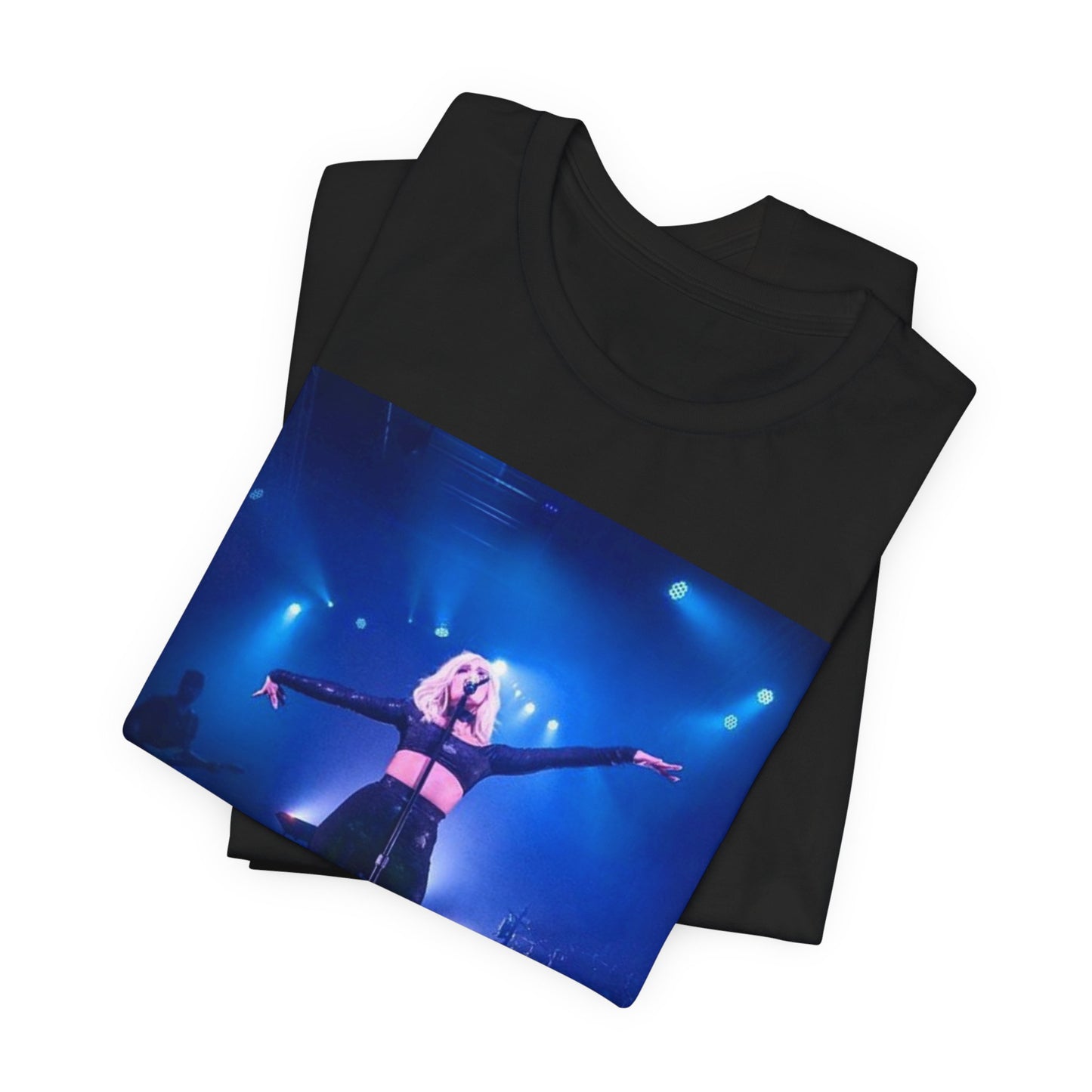 A black graphic t-shirt featuring a dynamic graphic or photo of Bebe Rexha performing live on stage.