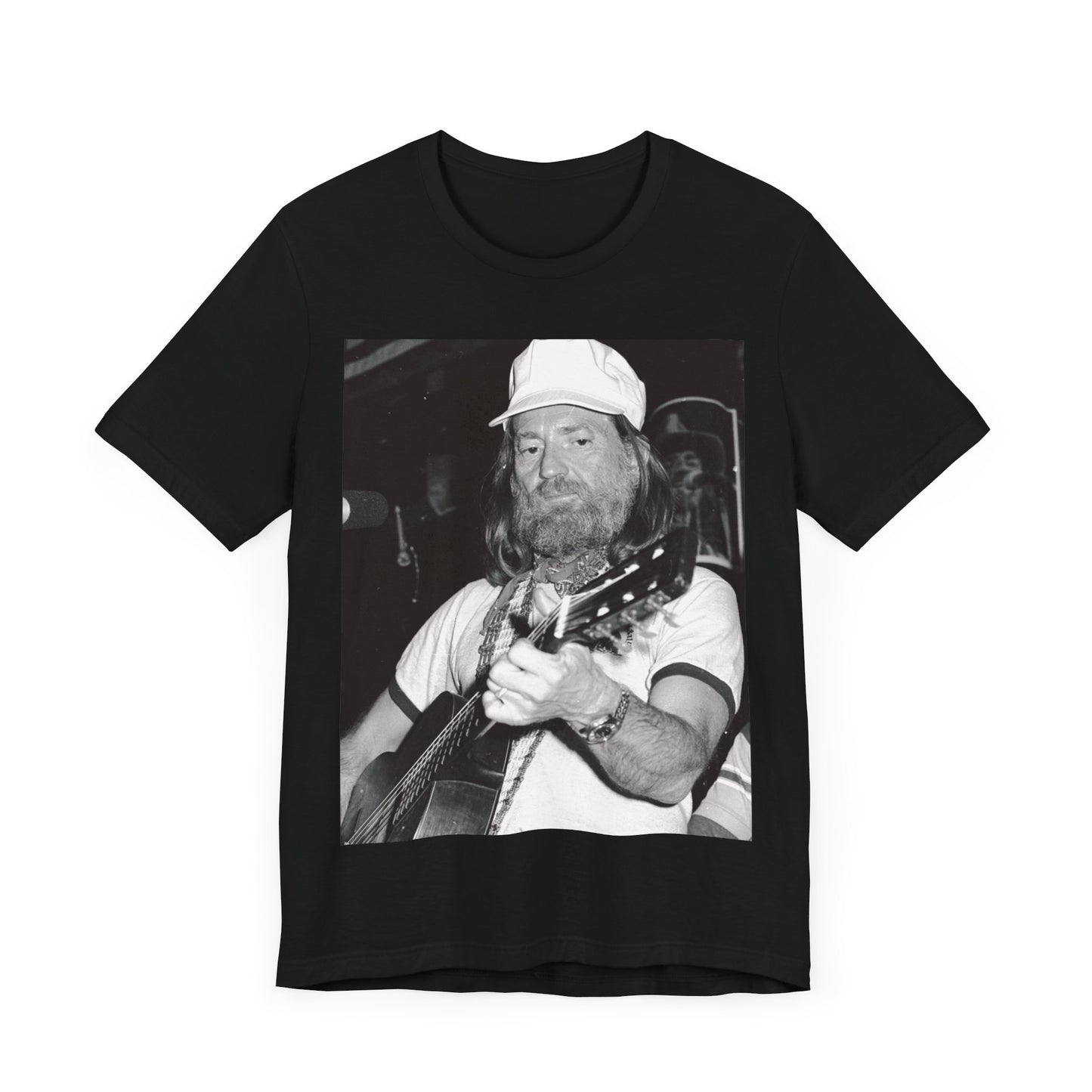A black graphic t-shirt featuring a 70s cool free spirit graphic of Willie Nelson.