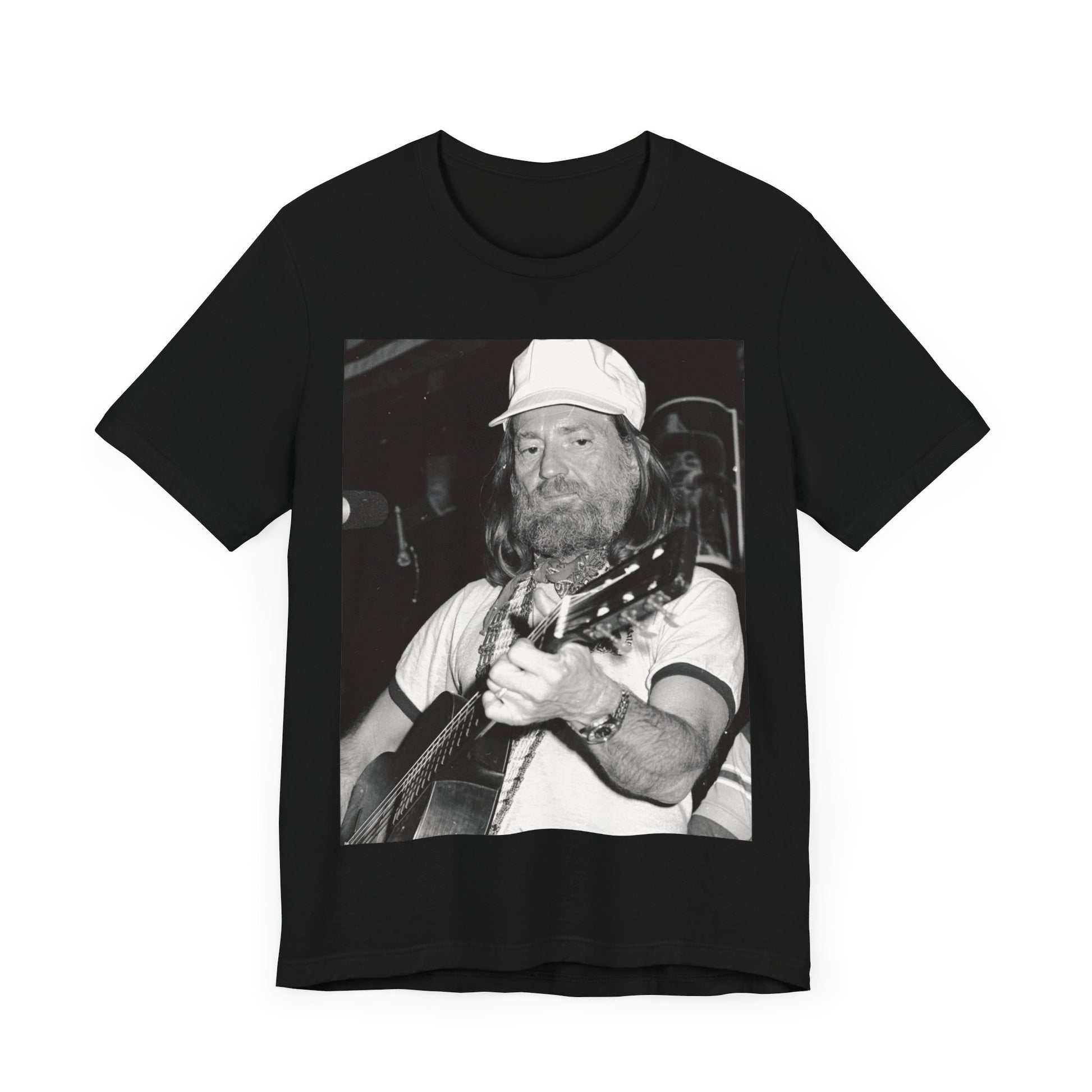 A black graphic t-shirt featuring a 70s cool free spirit graphic of Willie Nelson.