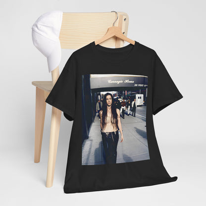 A black graphic t-shirt featuring a 90s-style graphic of Alanis Morissette with New York City elements or skyline in the background.