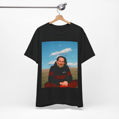 A black graphic t-shirt featuring a classic outlaw country graphic of Willie Nelson.
