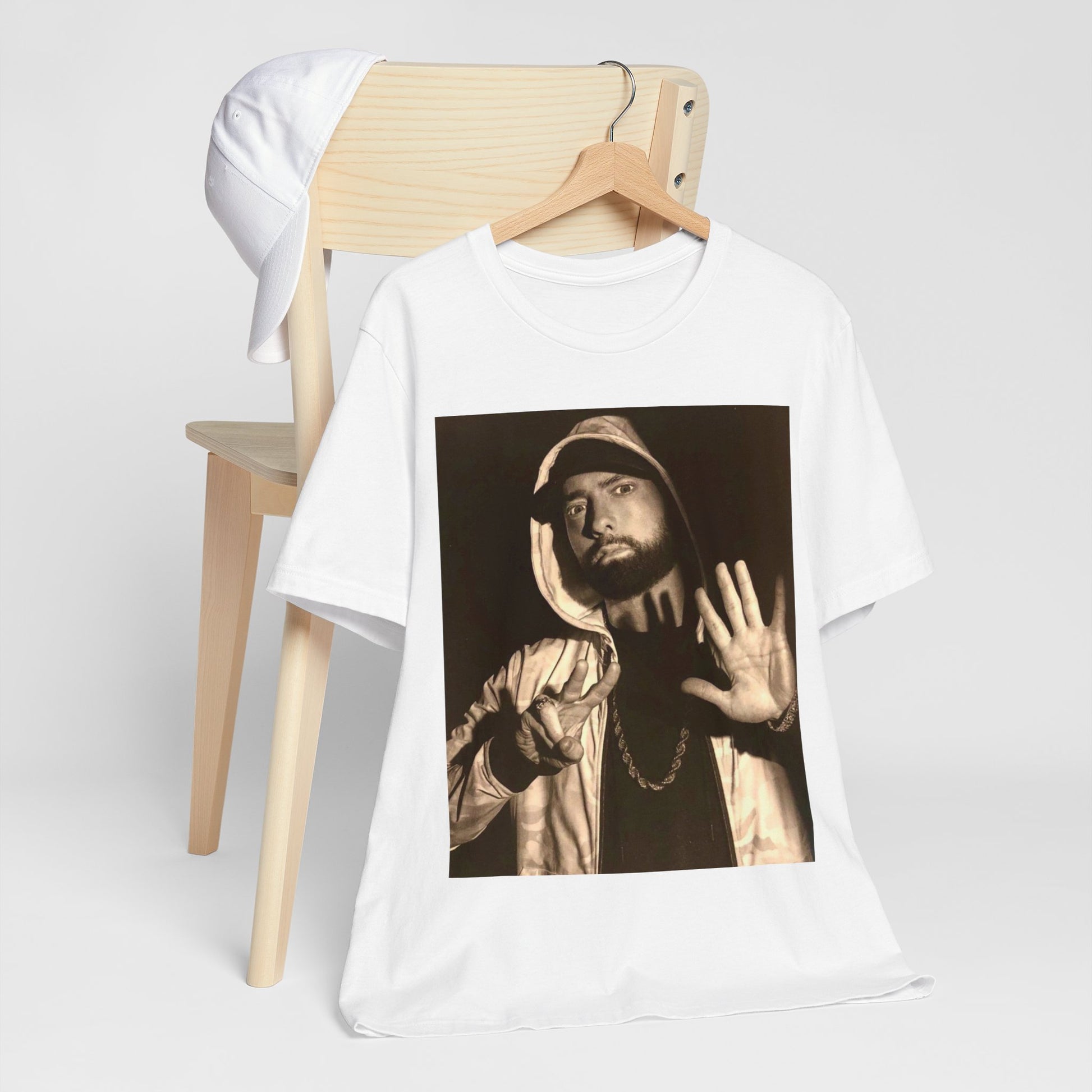 A black graphic t-shirt featuring a graphic of Eminem as an authentic underground rap icon.