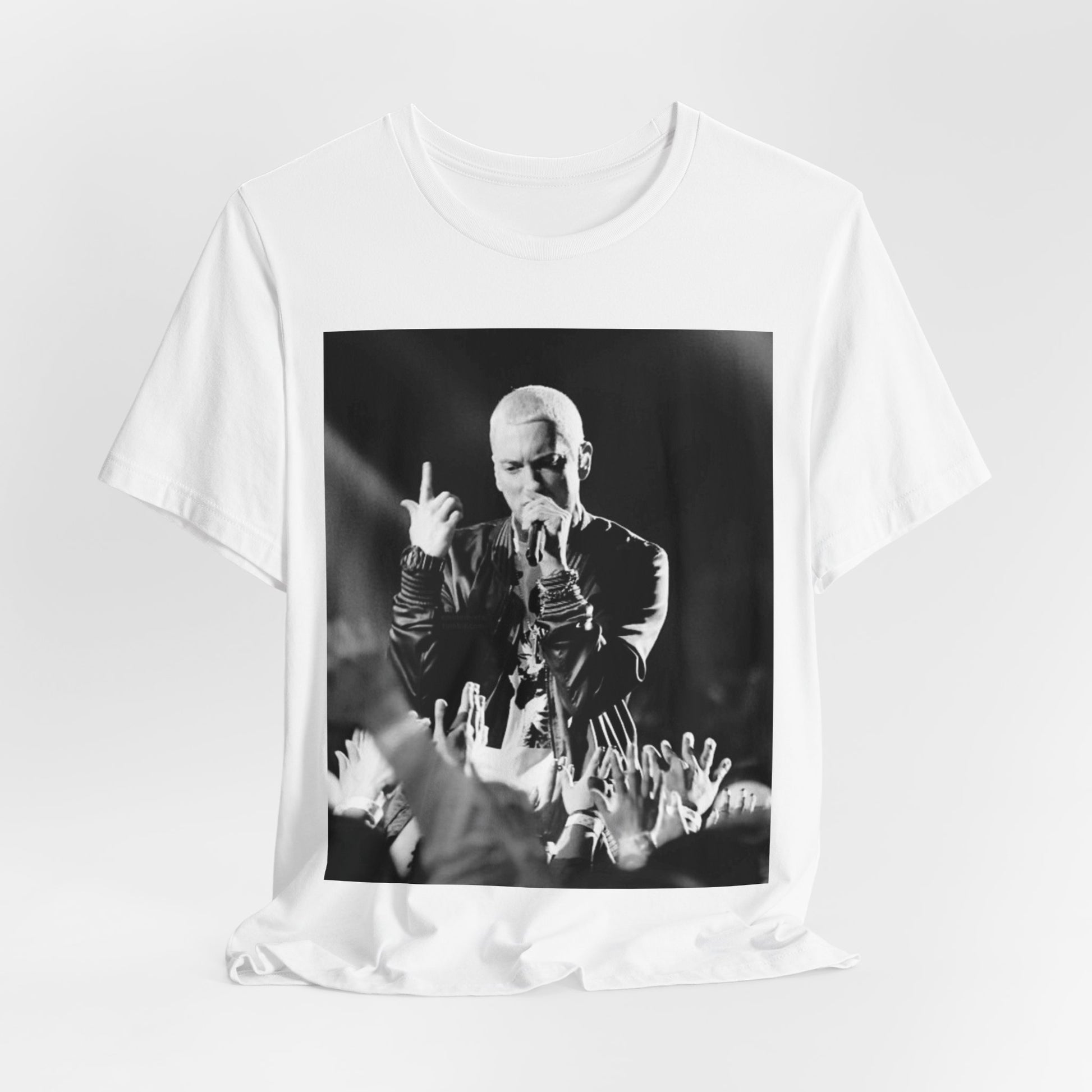 A black graphic t-shirt featuring a graphic or photo of Eminem performing live on stage.