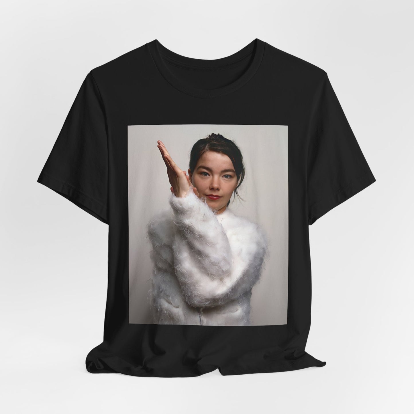 A black graphic t-shirt featuring a classic indie music graphic of Bjork.