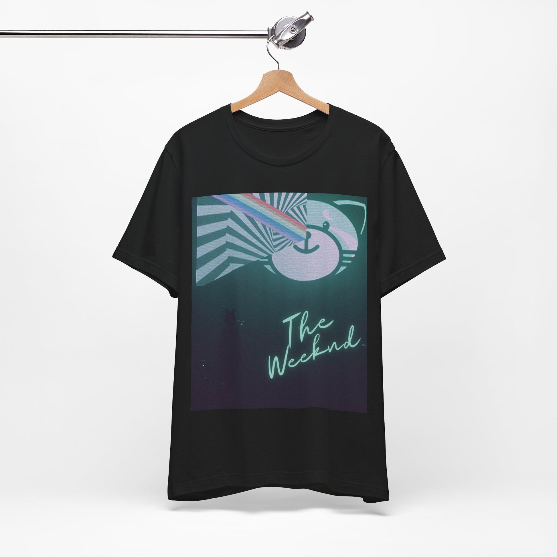 A black graphic t-shirt featuring a vintage concert graphic of The Weeknd from his 'Kiss Land' era.