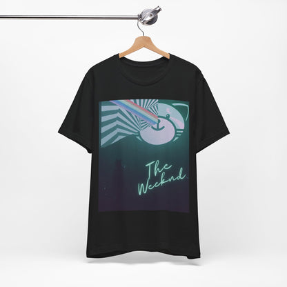 A black graphic t-shirt featuring a vintage concert graphic of The Weeknd from his 'Kiss Land' era.