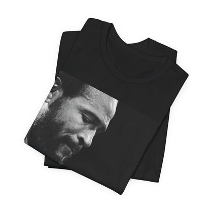 A black graphic t-shirt featuring a 70s graphic of Marvin Gaye emphasizing his soulful voice.