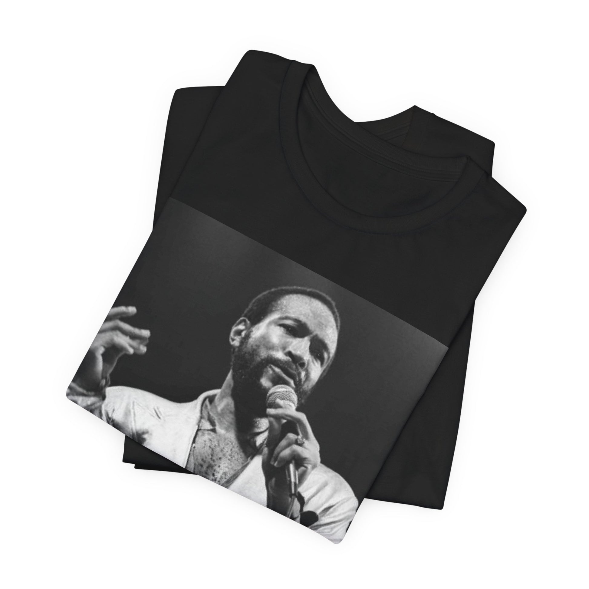 A black graphic t-shirt featuring a retro black and white photo or graphic of Marvin Gaye performing live on stage.
