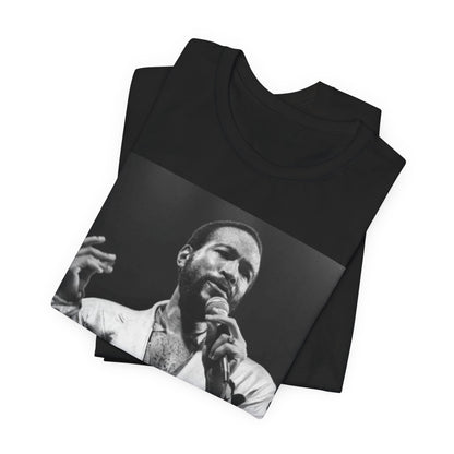 A black graphic t-shirt featuring a retro black and white photo or graphic of Marvin Gaye performing live on stage.