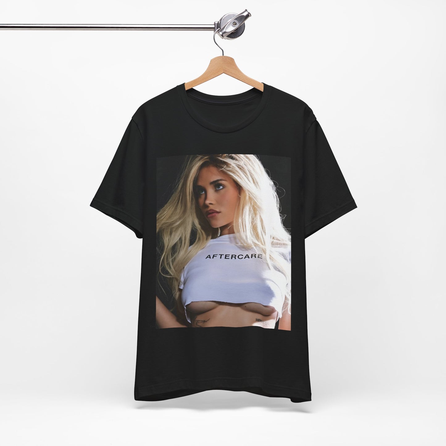 A black graphic t-shirt featuring a graphic related to Nessa Barrett's 'Aftercare' themes.