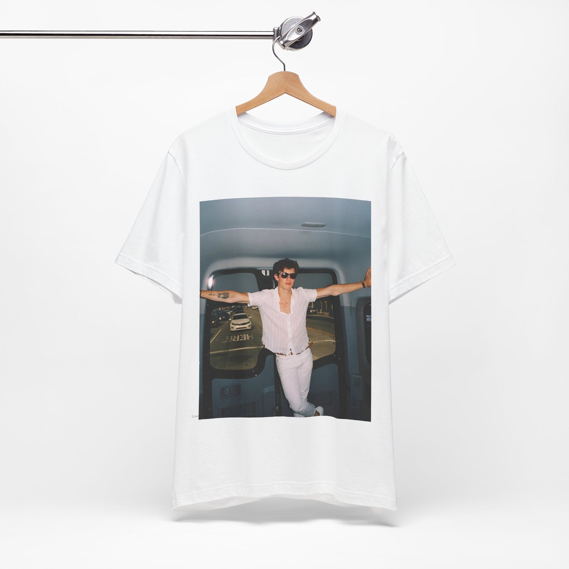 A black graphic t-shirt featuring a graphic of Shawn Mendes with a classic confident look.