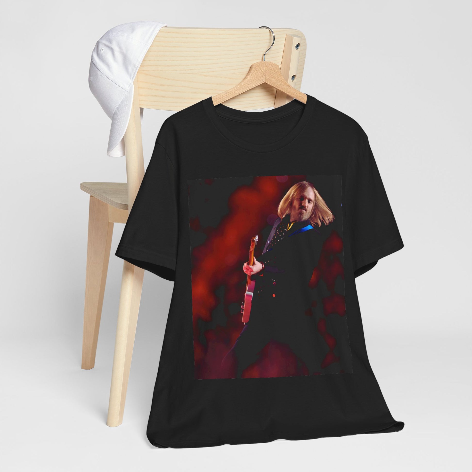 A black graphic t-shirt featuring a graphic or photo of Tom Petty as a powerhouse live performer.