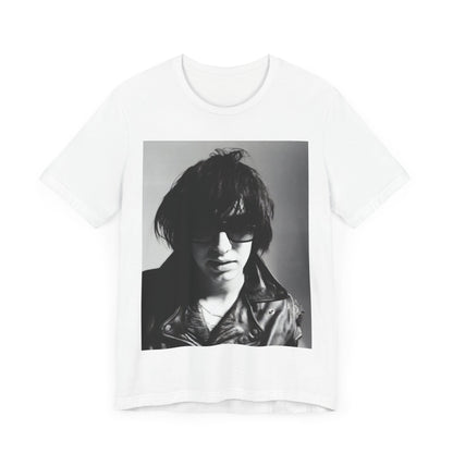 A black graphic t-shirt featuring a graphic related to The Strokes' 'Reptilia' song or era.