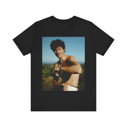 A black graphic t-shirt featuring a graphic of Shawn Mendes with a chill pop star look.