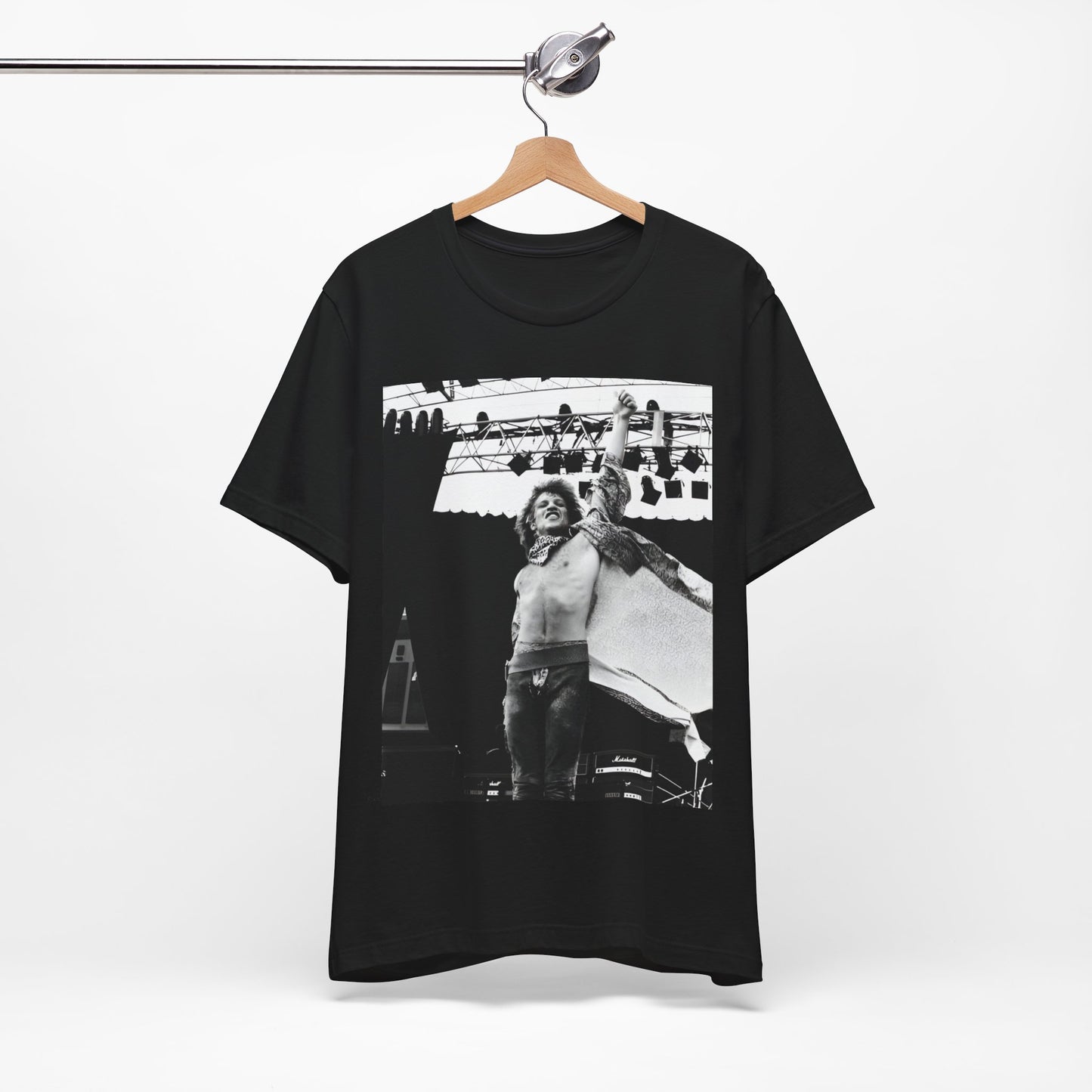 A black graphic t-shirt featuring an epic arena rock graphic of Bon Jovi performing on a large stage.