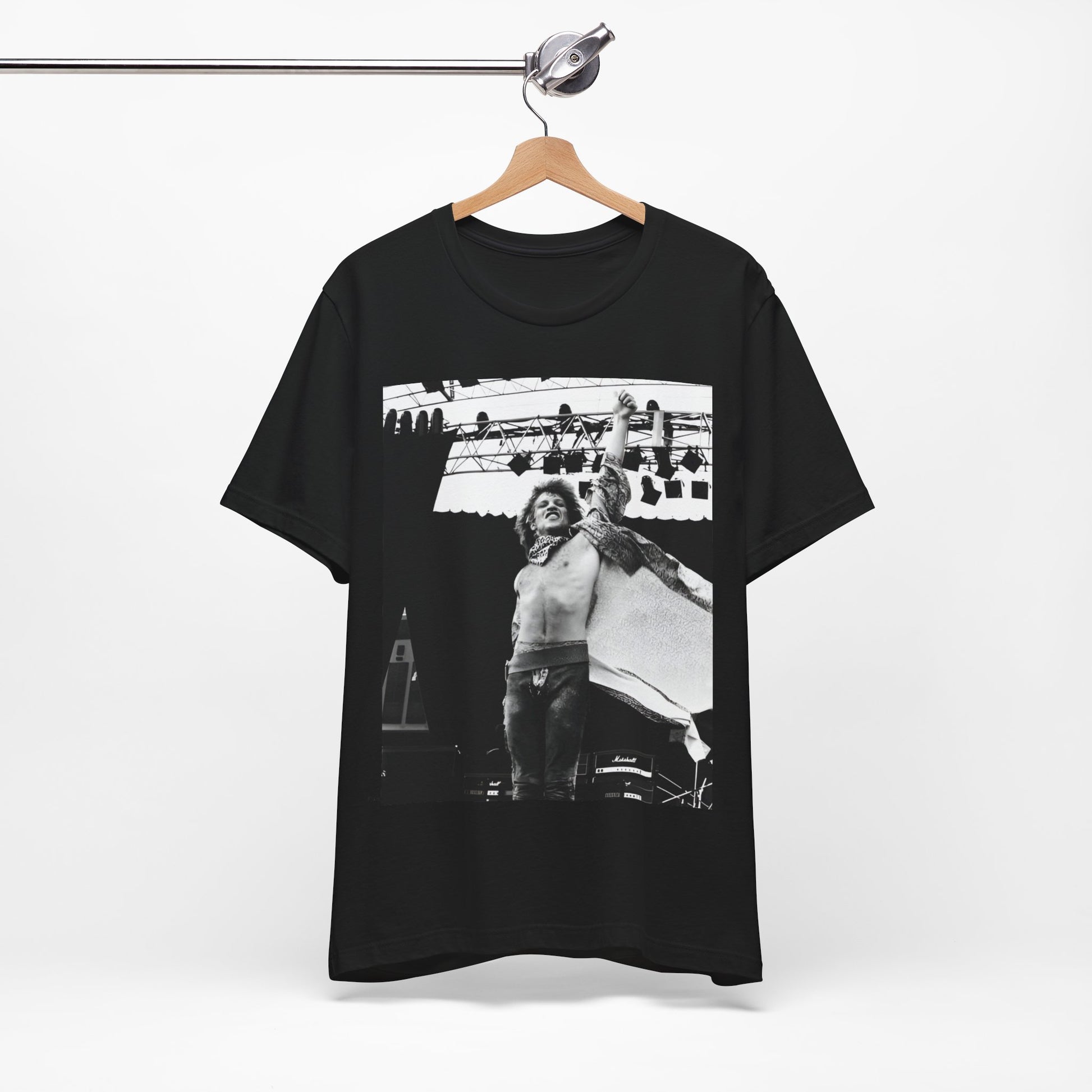 A black graphic t-shirt featuring an epic arena rock graphic of Bon Jovi performing on a large stage.