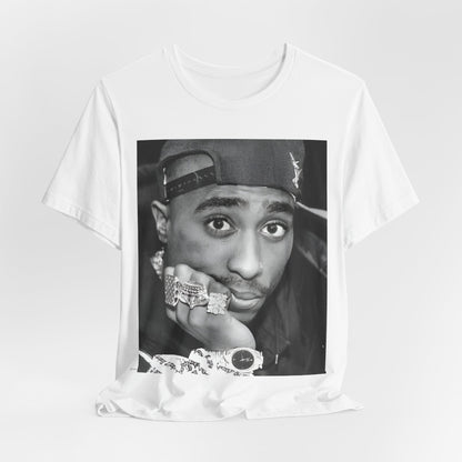 A black graphic t-shirt featuring a bold graphic of Tupac as a rap superstar.