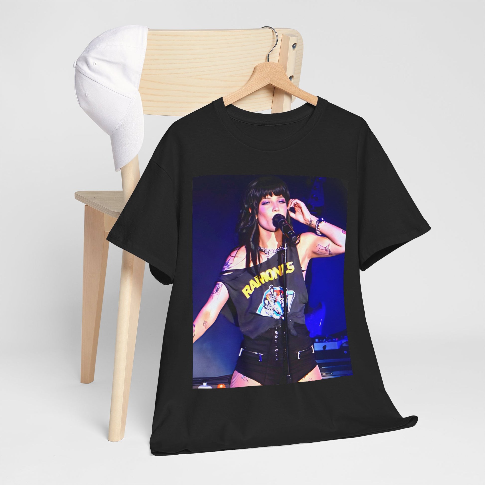 A black graphic t-shirt featuring a vintage graphic of Halsey as a pop rebel on stage.
