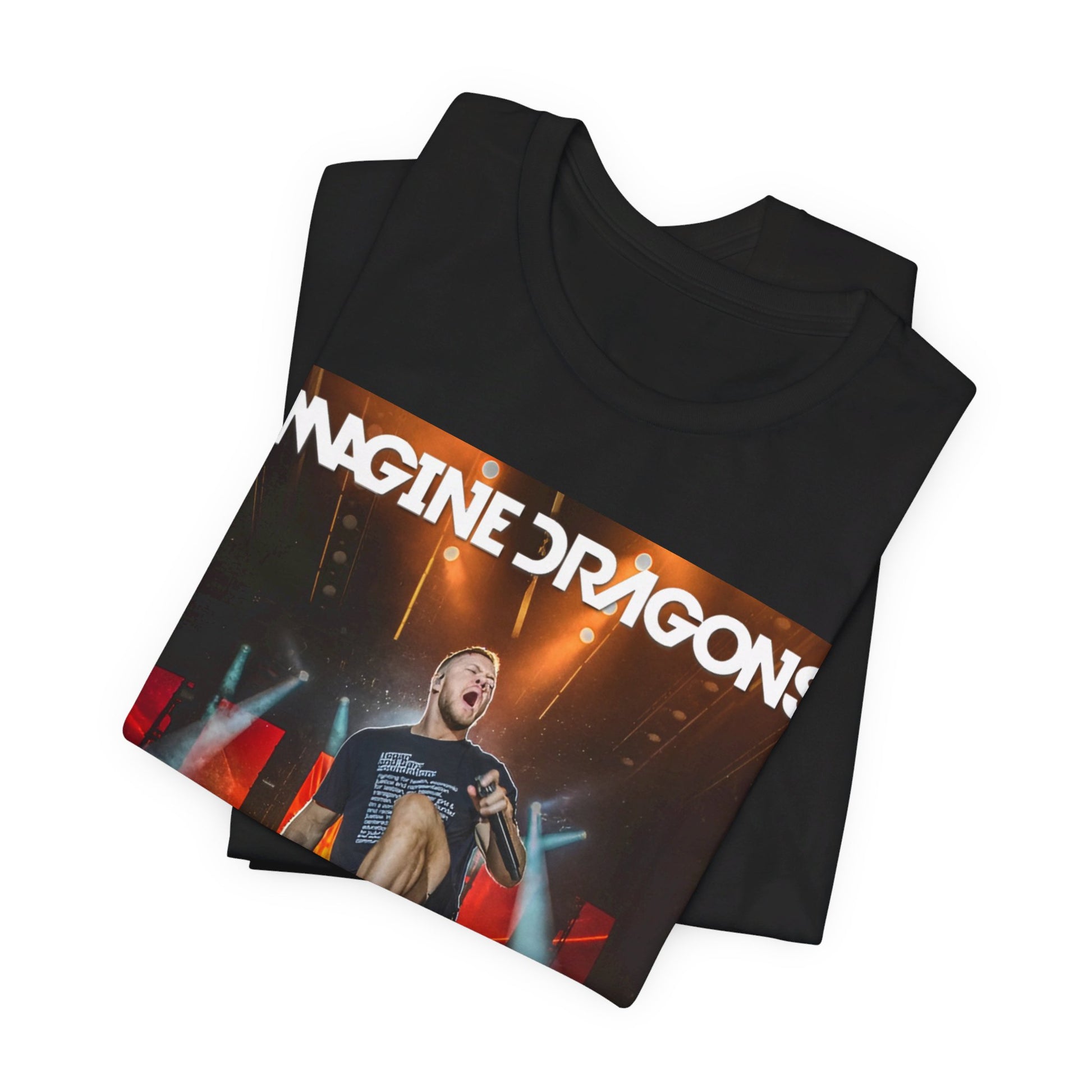 A black graphic t-shirt featuring a graphic or photo of Imagine Dragons performing live on stage.