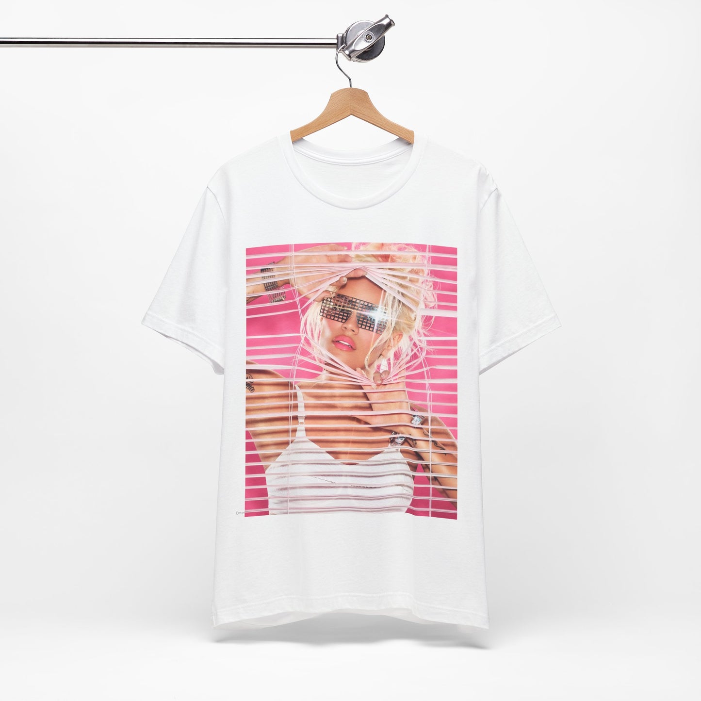 A black graphic t-shirt featuring a graphic of Karol G in a cool Latin trap style.