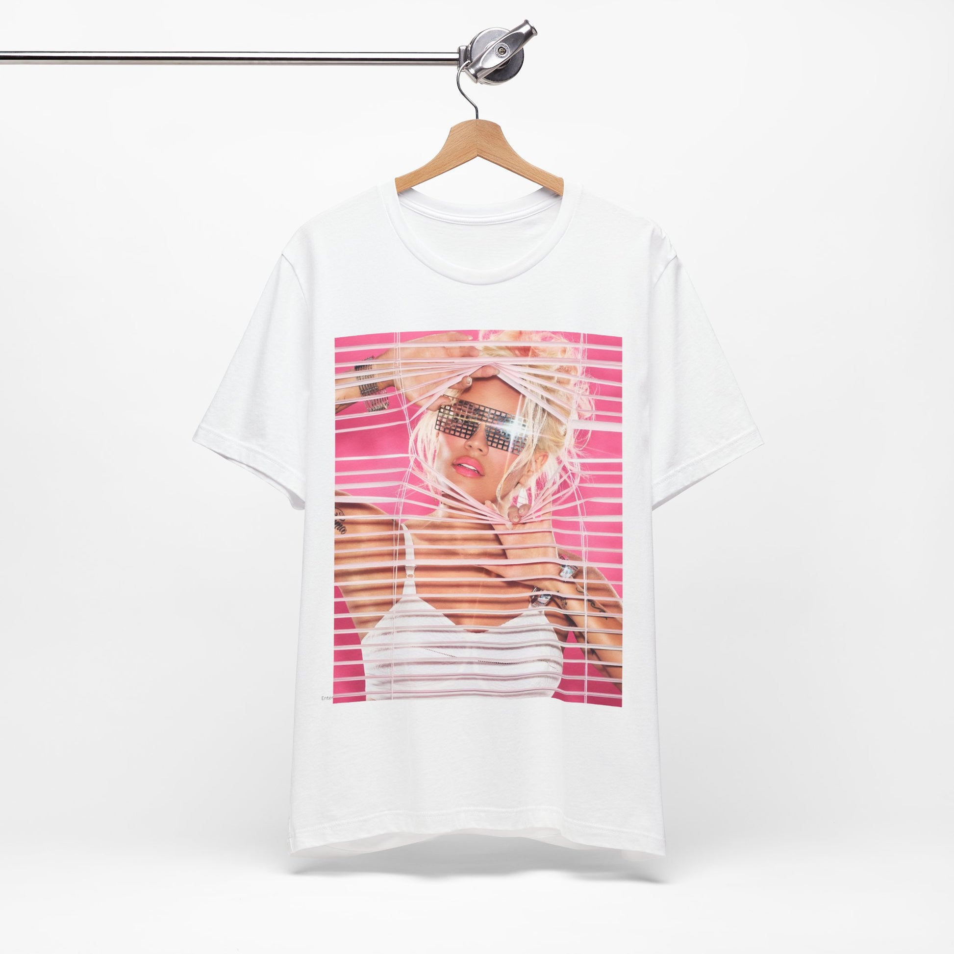 A black graphic t-shirt featuring a graphic of Karol G in a cool Latin trap style.