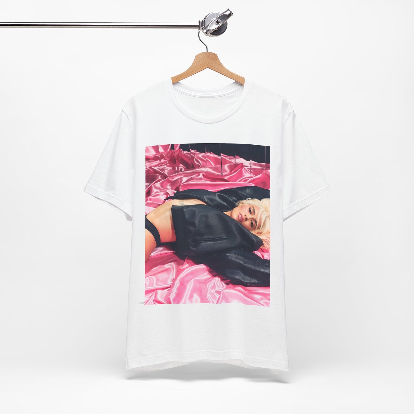 A black graphic t-shirt featuring a vintage aesthetic graphic related to Karol G's 'Tusa' era.