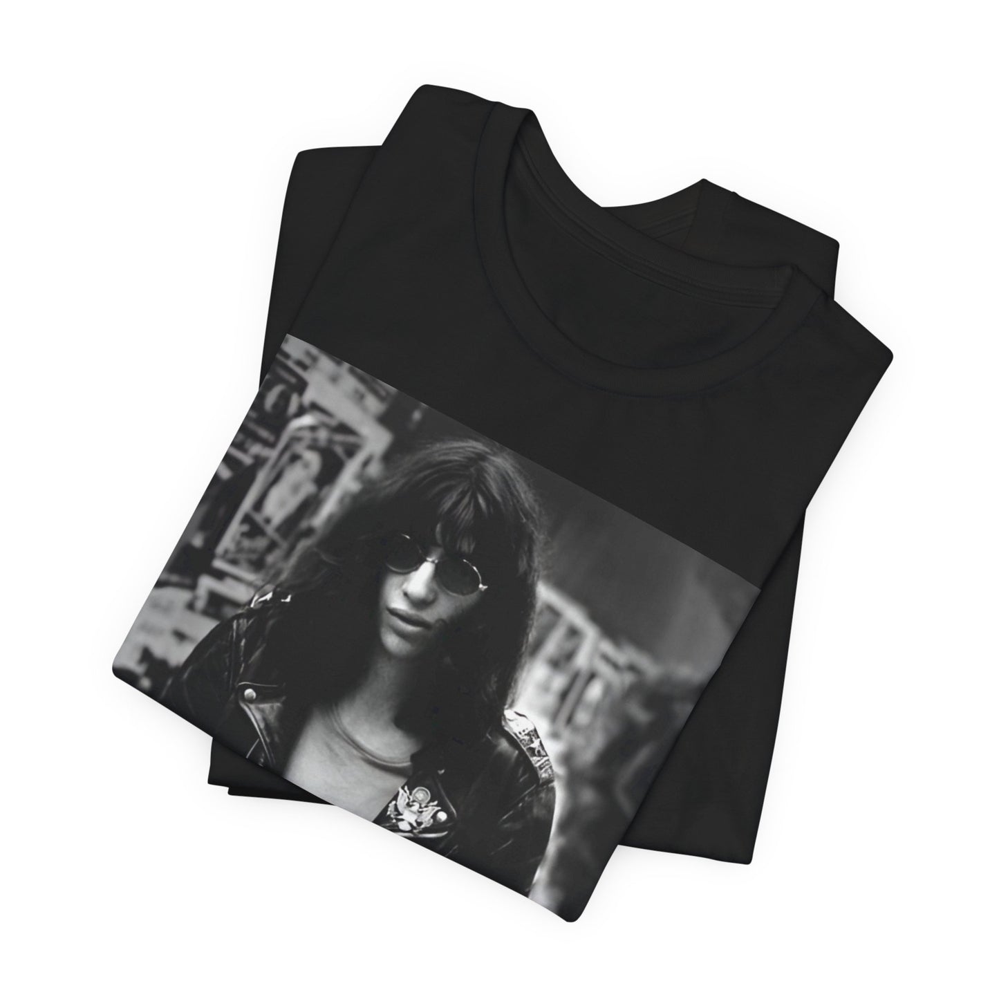 A black graphic t-shirt featuring a 70s black and white photo portrait of Joey Ramone from Ramones.
