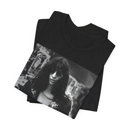 A black graphic t-shirt featuring a 70s black and white photo portrait of Joey Ramone from Ramones.