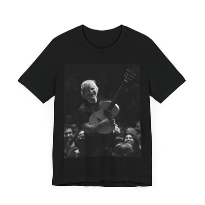 A black graphic t-shirt featuring a photo of Ed Sheeran performing live with his guitar.