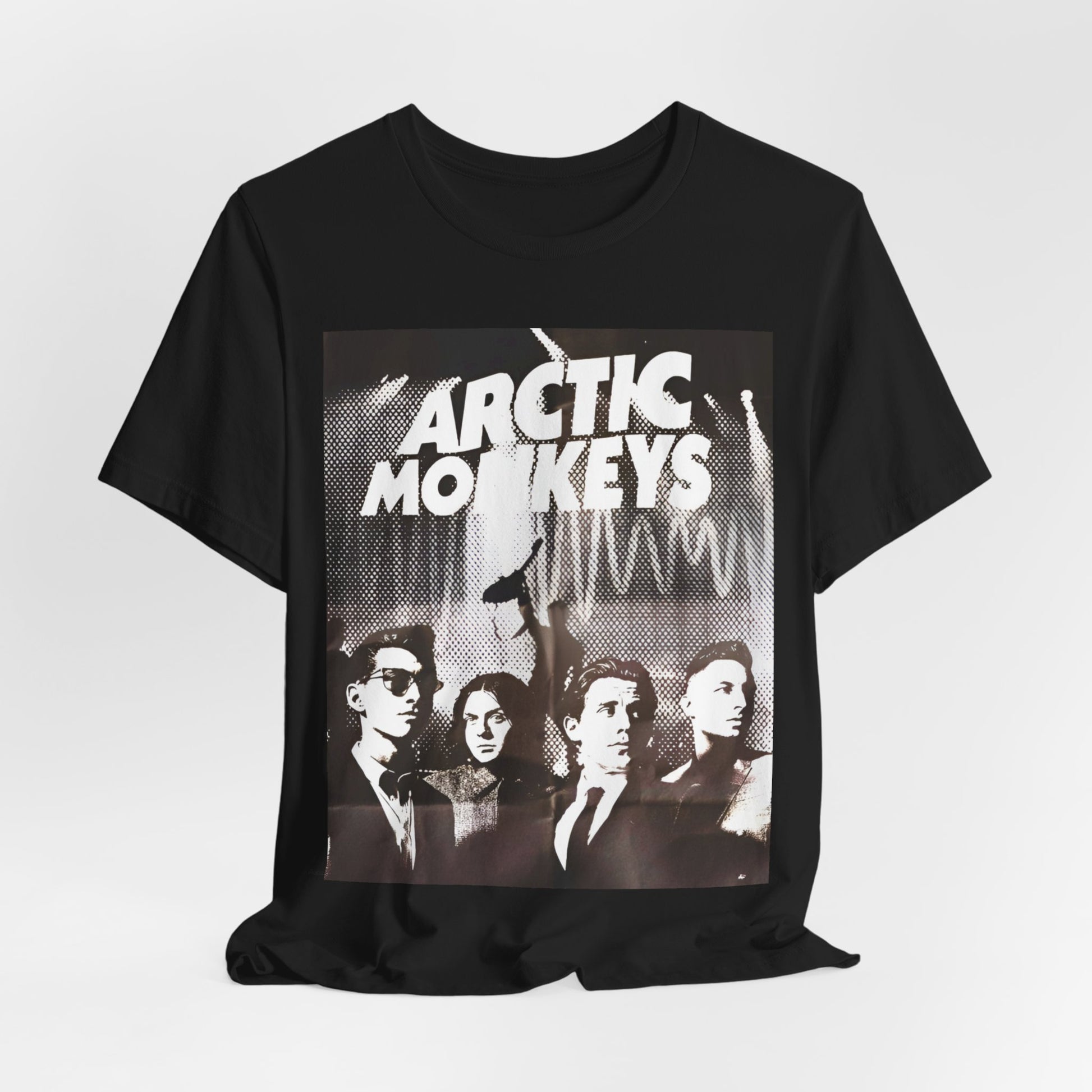 A black graphic t-shirt featuring a retro-style logo for the band Arctic Monkeys.