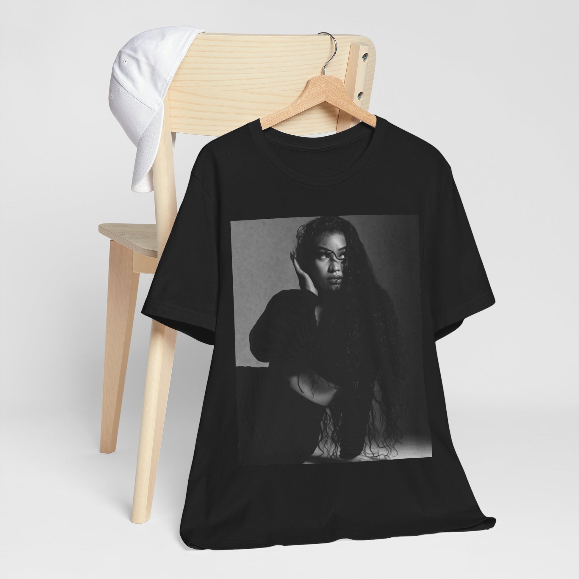 A black graphic t-shirt featuring a black and white graphic or photo of Nicki Minaj as a glamour queen.