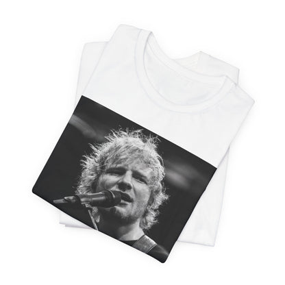 A black graphic t-shirt featuring a black and white photo of Ed Sheeran performing live.