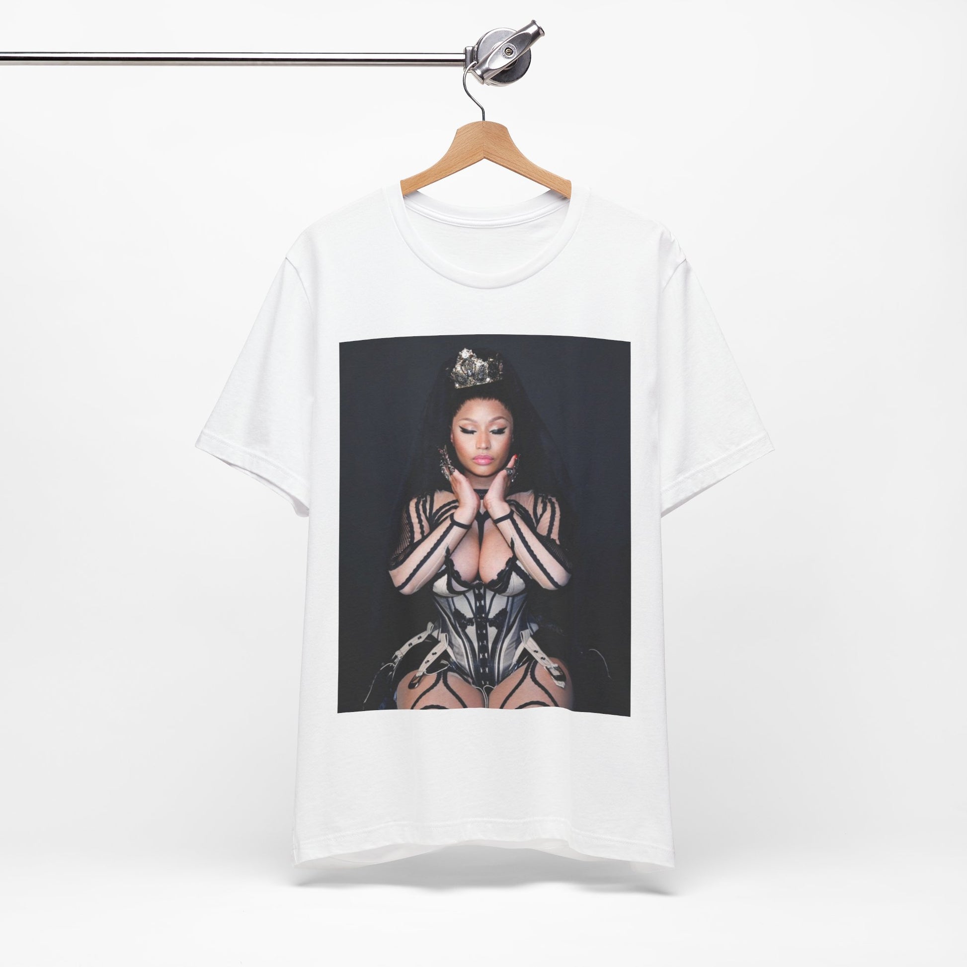 A black graphic t-shirt featuring a vintage graphic of Nicki Minaj as the Queen of Rap.
