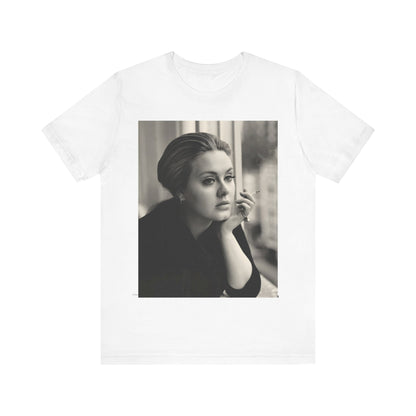 A black graphic t-shirt featuring a black and white photo of Adele, showing her with a serene or thoughtful expression.