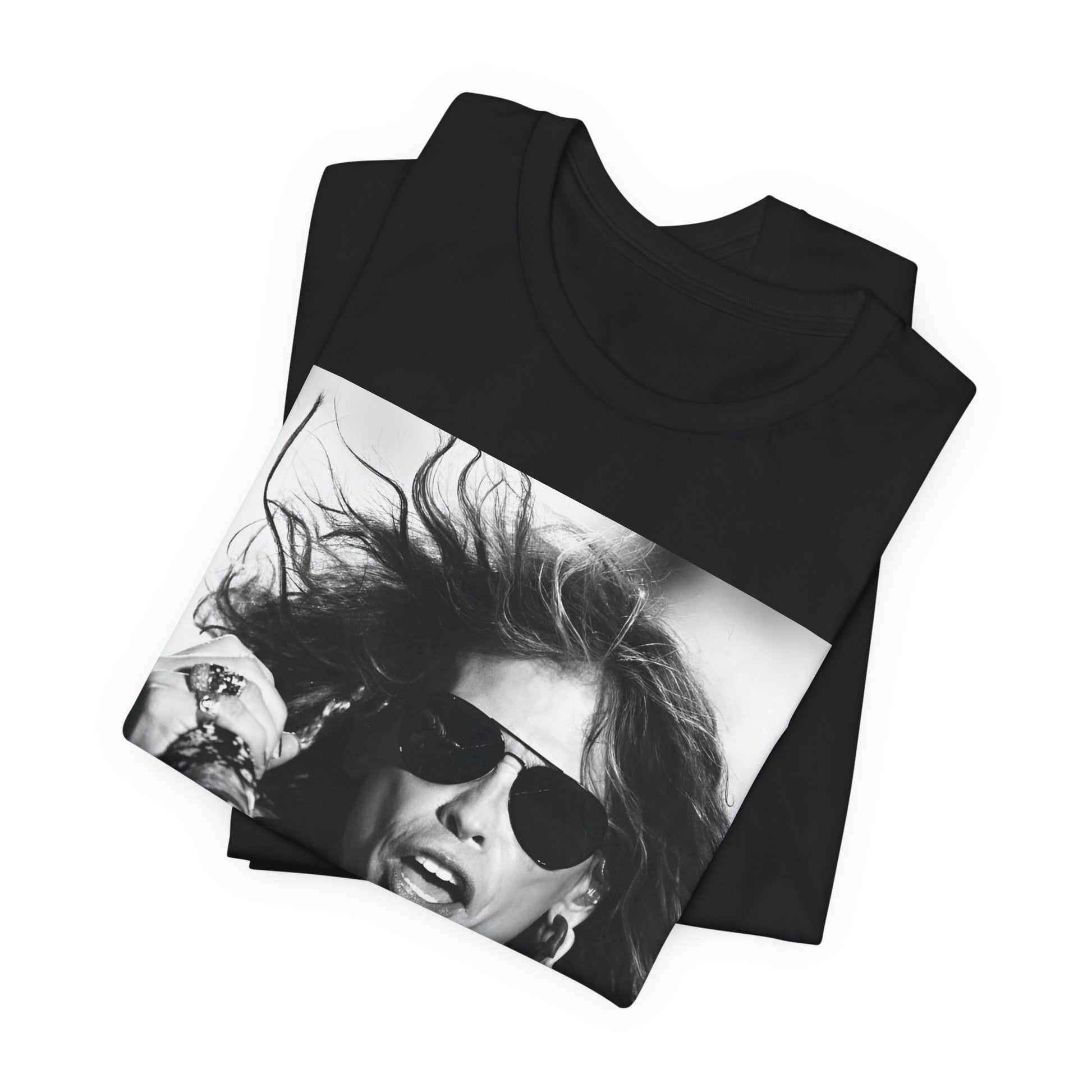 A black graphic t-shirt featuring a black and white photo of Aerosmith's Steven Tyler with his signature scarf and microphone, captured during a dynamic performance.