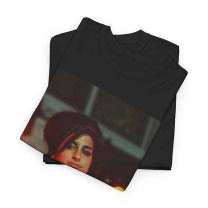 A black graphic t-shirt featuring a stylized graphic of Amy Winehouse, possibly with a crown or 'R&B Queen' text, emphasizing her soulful presence.