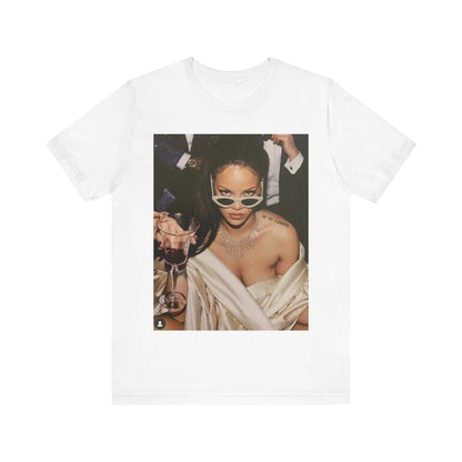 A black graphic t-shirt featuring a graphic of Rihanna as a 'Bad Gal Riri' fashion icon.