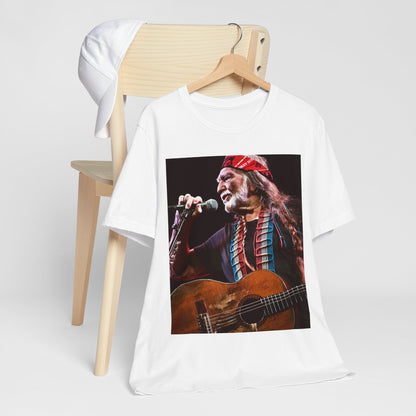 A black graphic t-shirt featuring a graphic of Willie Nelson with his iconic long hair and bandana.