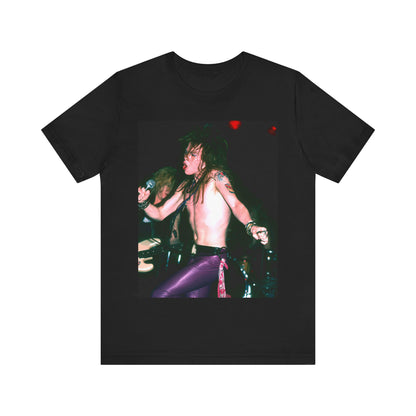 A black graphic t-shirt featuring a graphic of Axl Rose from Guns N' Roses performing on stage in the 80s.
