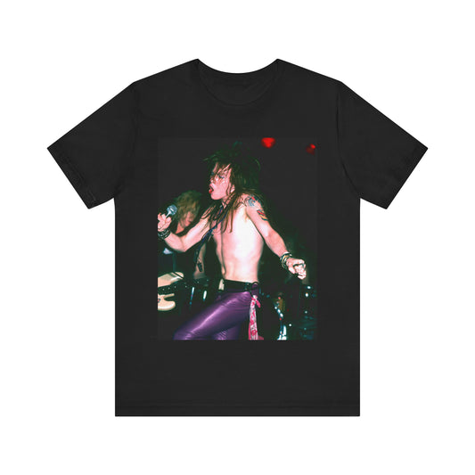 A black graphic t-shirt featuring a graphic of Axl Rose from Guns N' Roses performing on stage in the 80s.