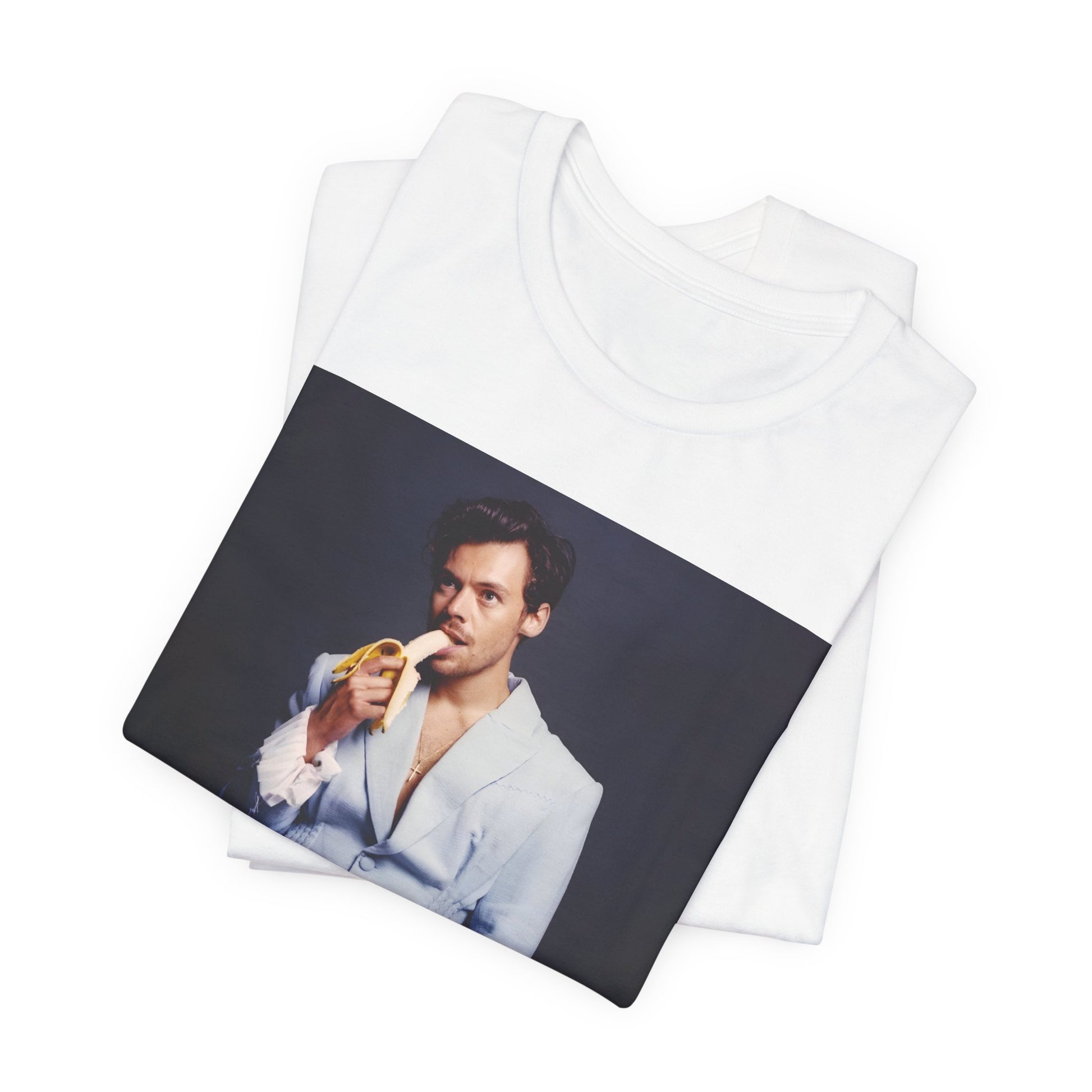 A black graphic t-shirt featuring a graphic related to Harry Styles and his One Direction legacy.