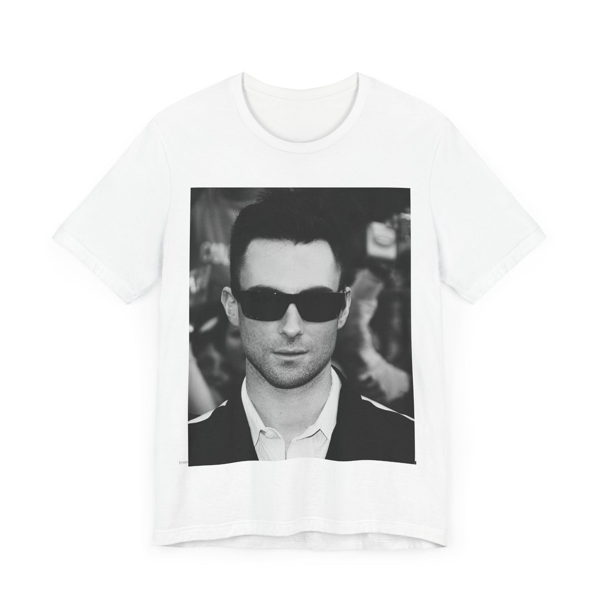 A black and white high-fashion photoshoot photo of Adam Levine, frontman of Maroon 5, looking confidently at the camera.