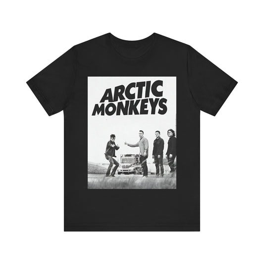 A black graphic t-shirt featuring the Arctic Monkeys logo in black and white.