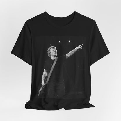 A black graphic t-shirt featuring a black and white graphic or photo of Ed Sheeran performing live on stage.