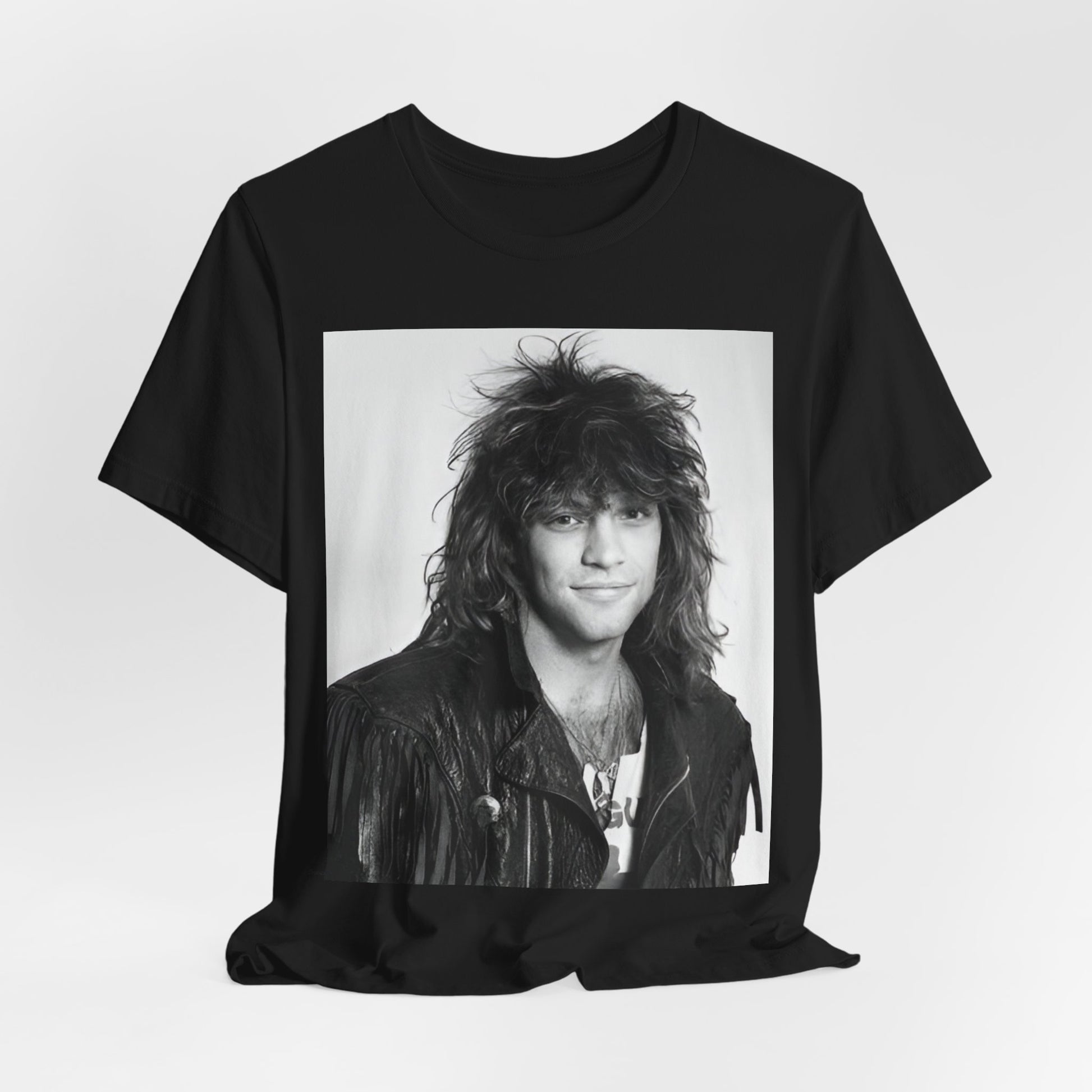 A black graphic t-shirt featuring a black and white photo of Bon Jovi from a 90s tour, performing on stage.