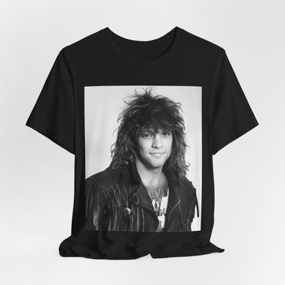 A black graphic t-shirt featuring a black and white photo of Bon Jovi from a 90s tour, performing on stage.