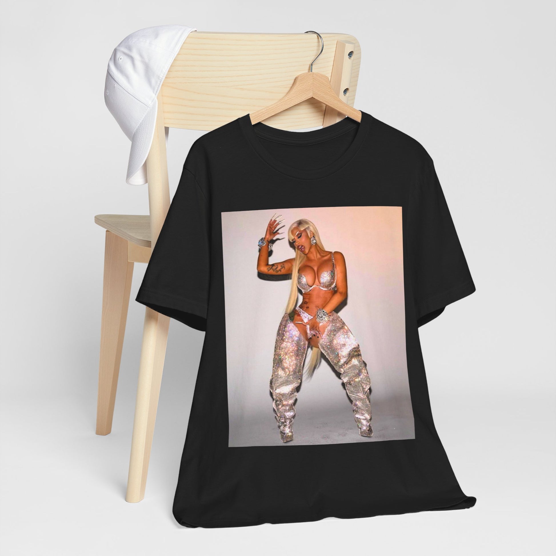 A black graphic t-shirt featuring a vintage graphic of Cardi B as a 'Bronx Queen' or rap icon.