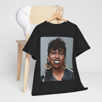 A black graphic t-shirt featuring a bold graphic of Missy Elliott as a rap superstar.