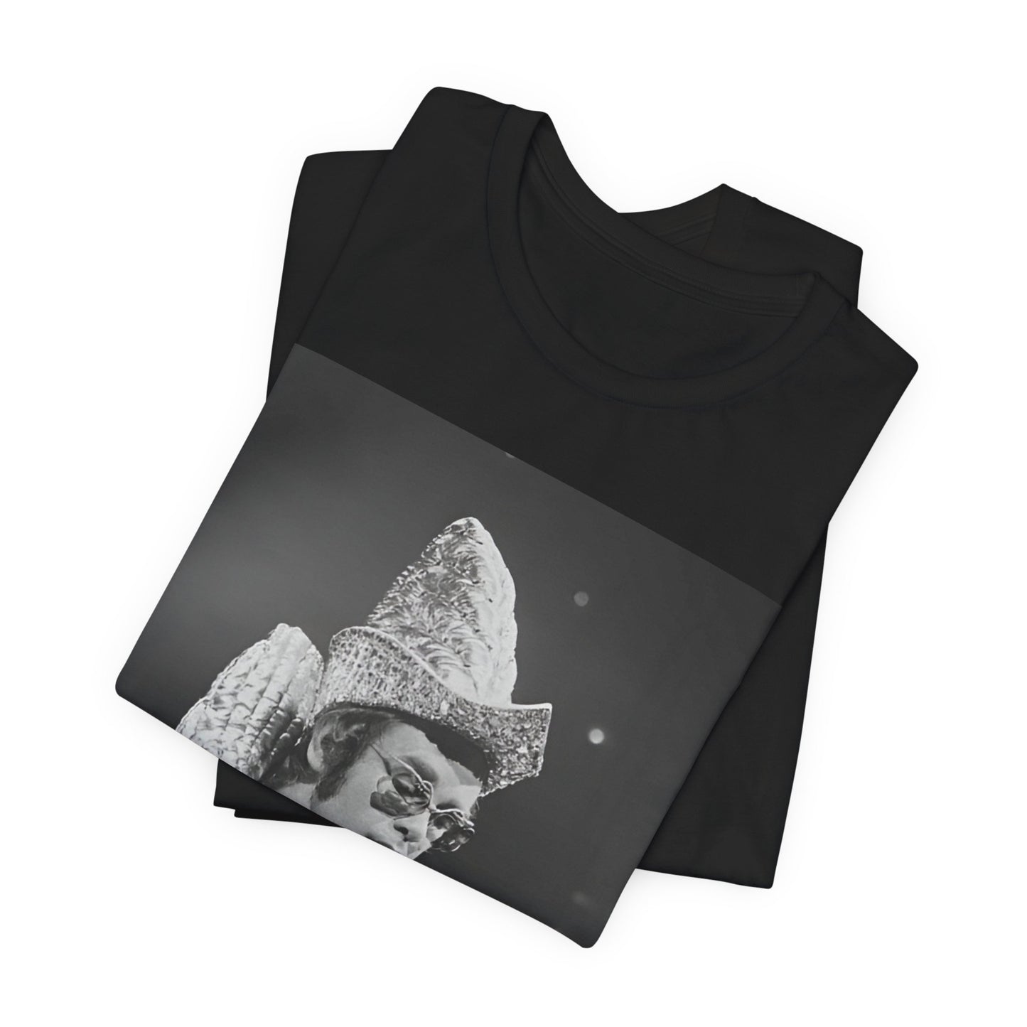 A black graphic t-shirt featuring a 70s pop aesthetic graphic of Elton John.