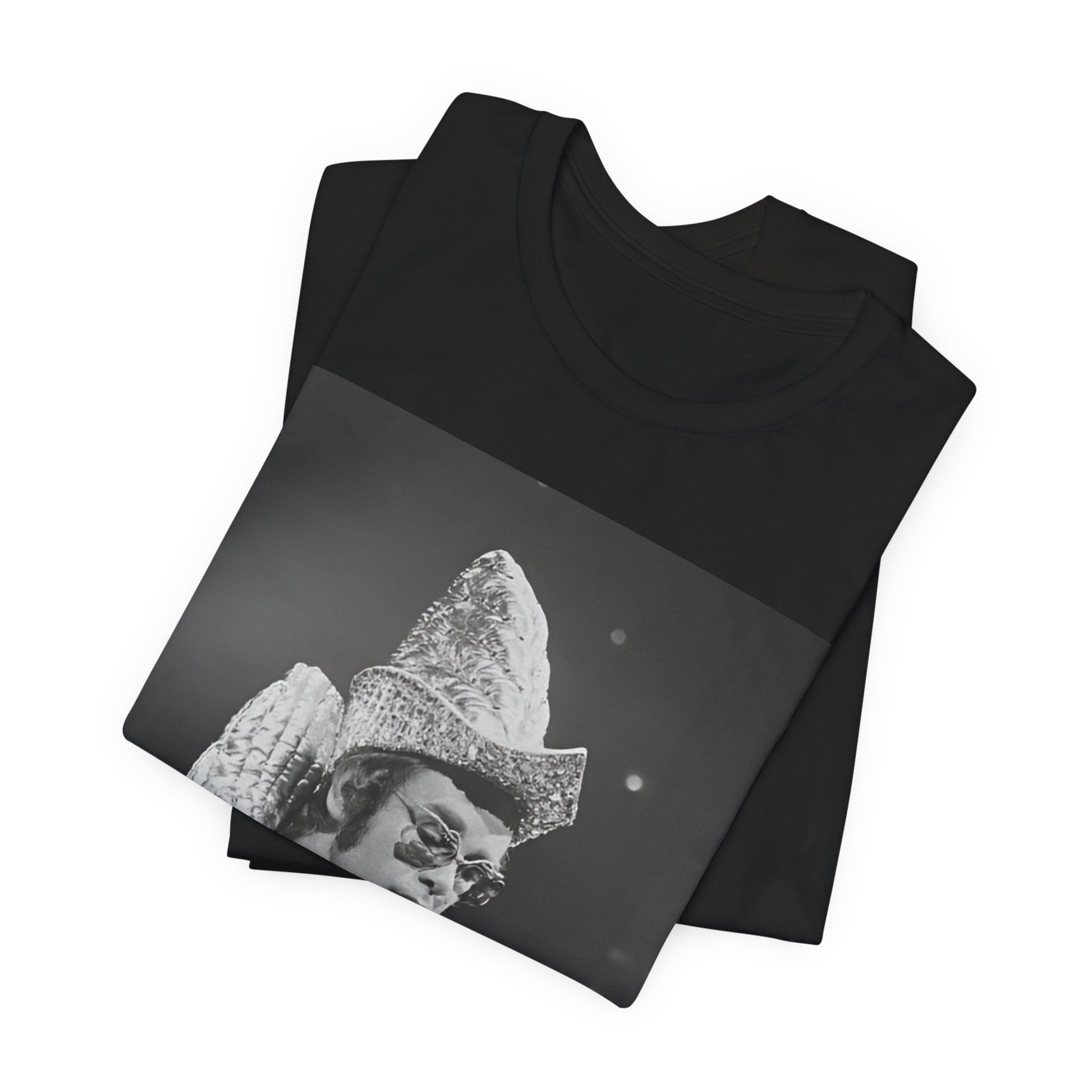 A black graphic t-shirt featuring a 70s pop aesthetic graphic of Elton John.